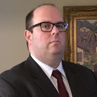 Mr. Michael E. Houghton Esq.